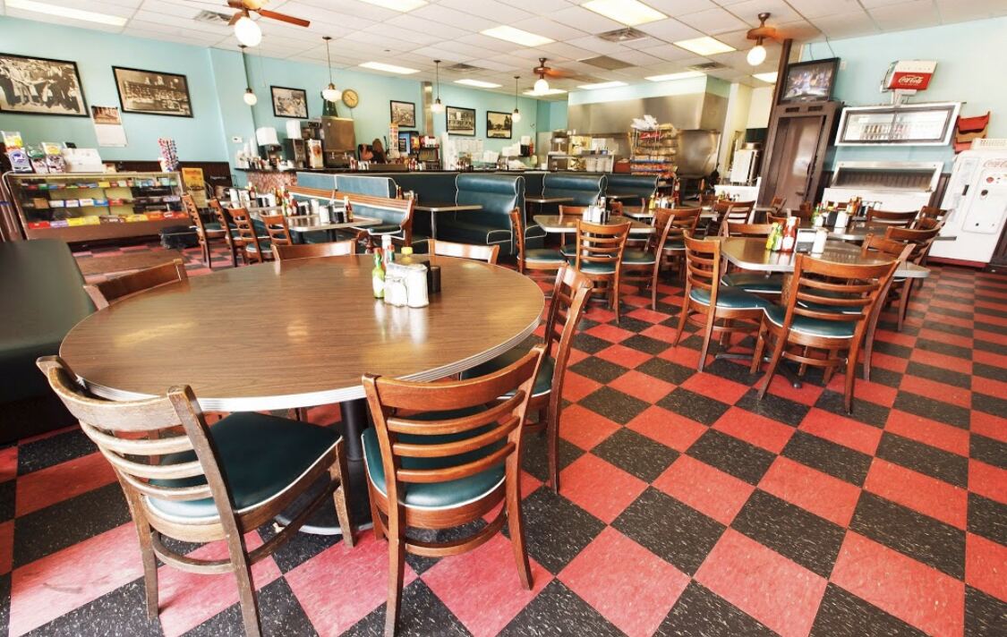 The Avalon Diner dining room with booths and vintage photos