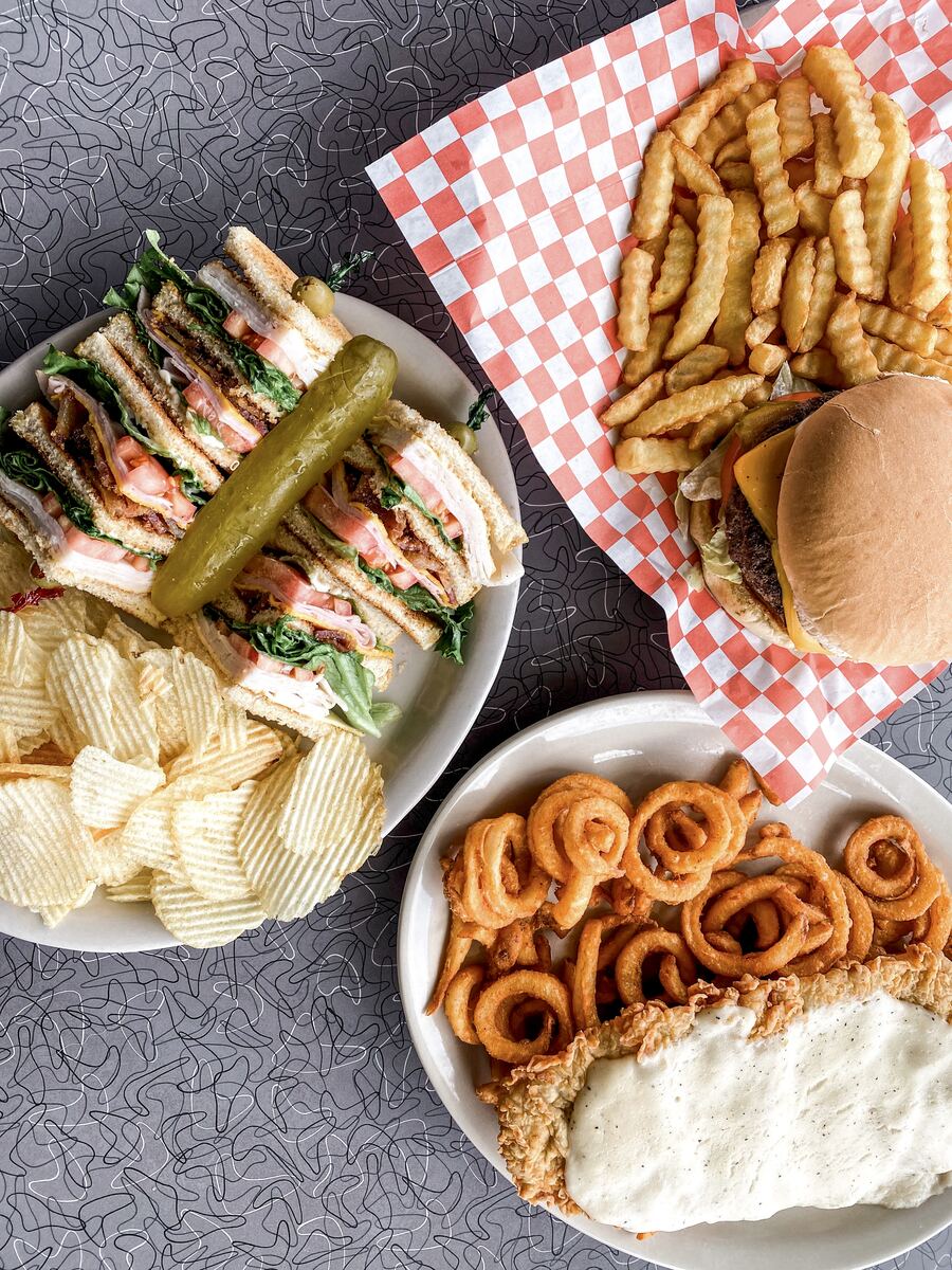 Club sandwich, burger, curly fries and chicken fried steak